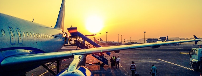 Photo of outside plane at sunset for Travel Insurance BC